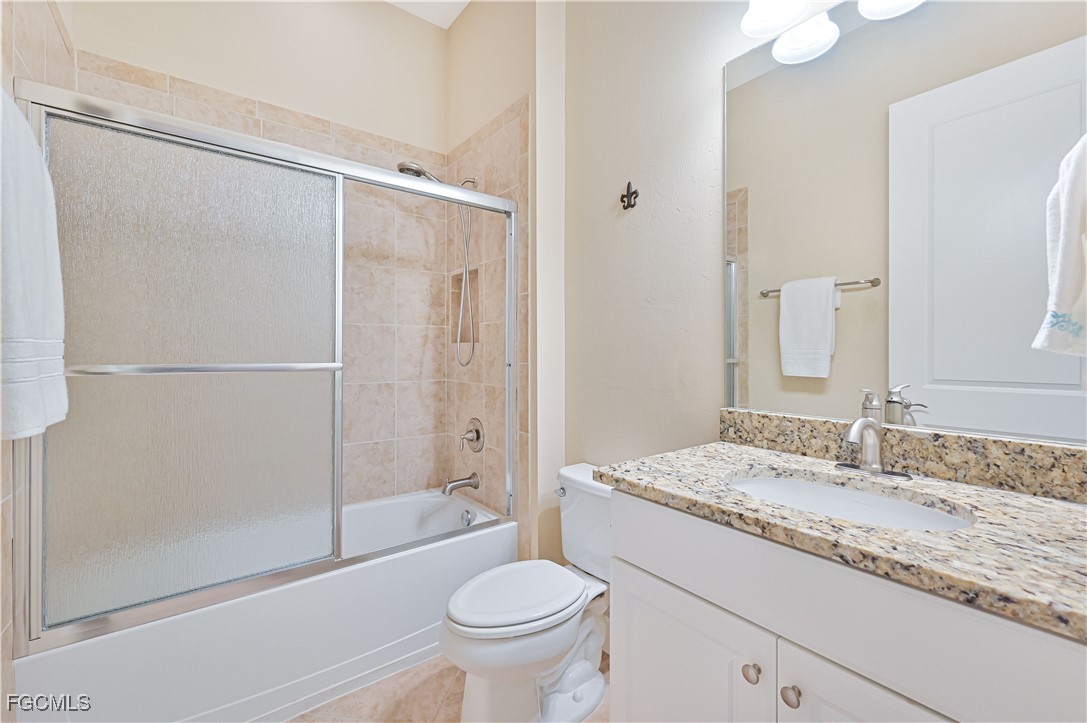 17283 Walnut Run Drive Alva, FL 33920 - Photo 35 of 49 a bathroom with a granite countertop sink toilet and shower