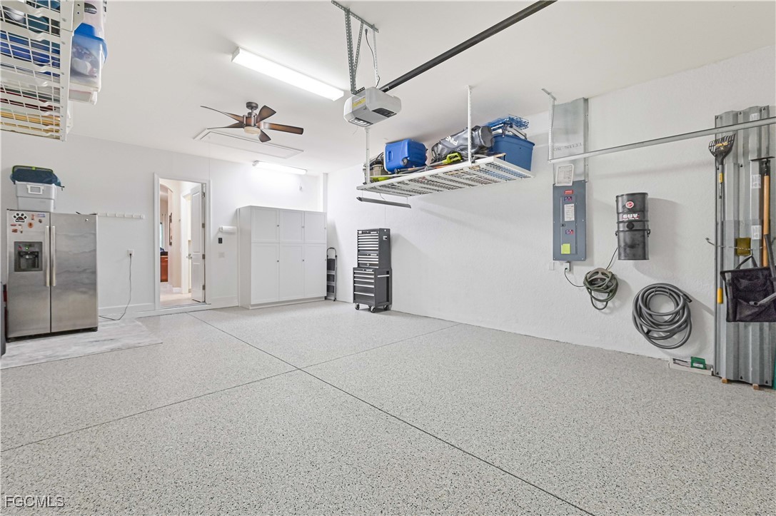 17283 Walnut Run Drive Alva, FL 33920 - Photo 39 of 49 a view of a storage & utility room with refrigerator and washer
