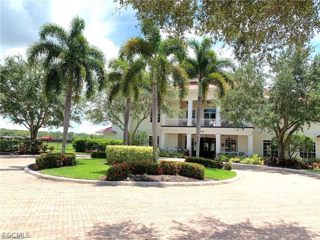 17283 Walnut Run Drive Alva, FL 33920 - Photo 41 of 49 a view of a house with a swimming pool and a bench