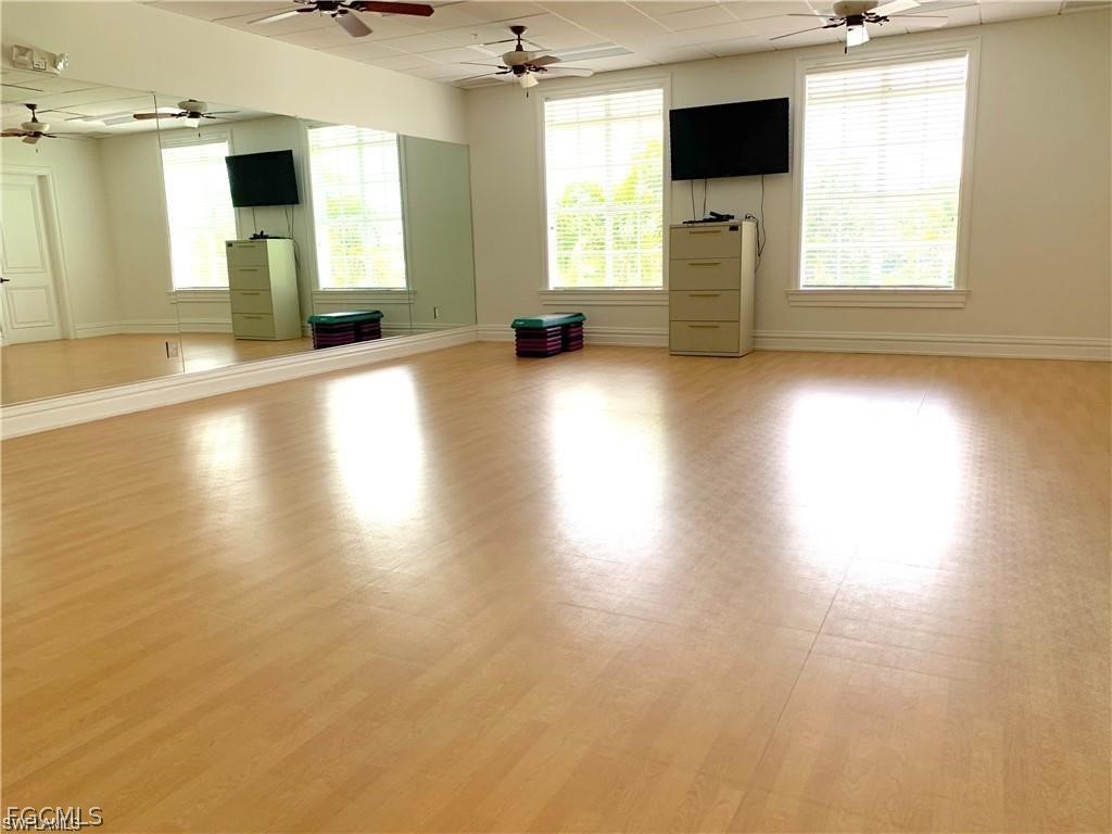 17283 Walnut Run Drive Alva, FL 33920 - Photo 45 of 49 an empty room with windows and fireplace