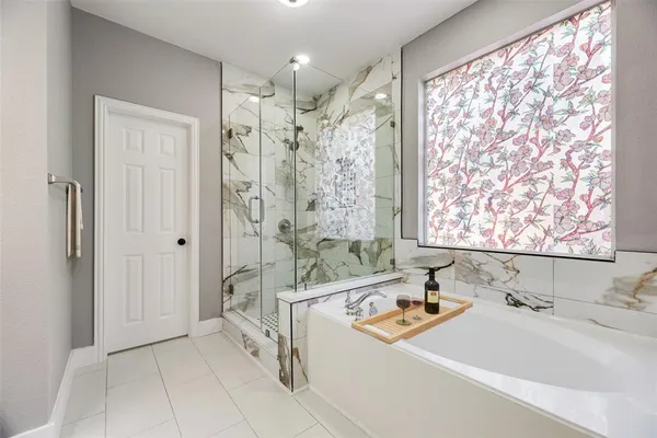 a bathroom with a bathtub and a sink