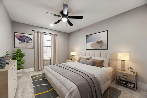 a bedroom with a large bed and a chandelier