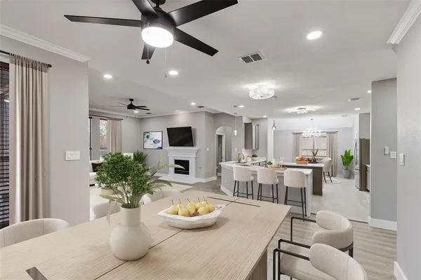 a dining room with furniture a window and kitchen view