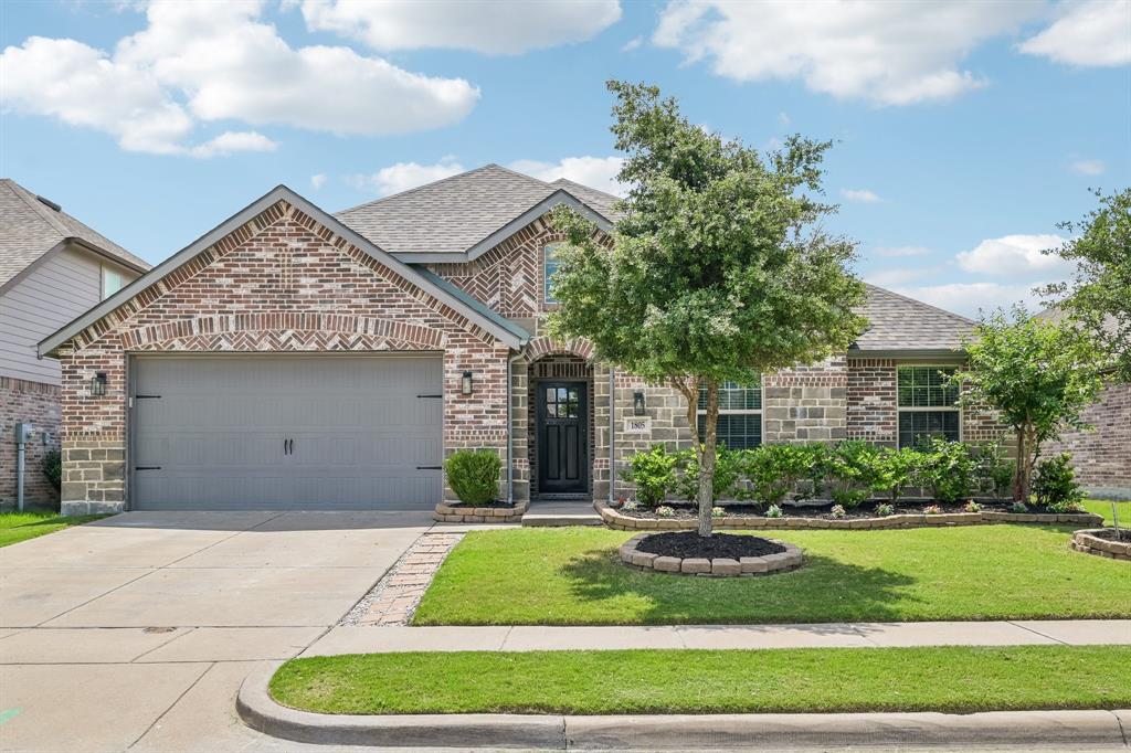 1805 Huntsman Way Forney, TX 75126 - Photo 1 of 34 Front exterior featuring a combination brick facade, an attached two-car garage, a concrete driveway, a well-kept lawn, and mature landscaping