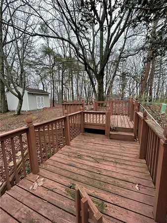 a view of deck with wooden floor and outdoor seating
