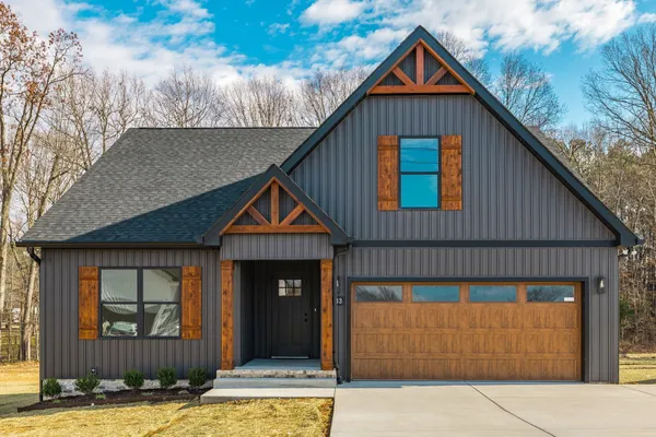 a front view of a house with garage