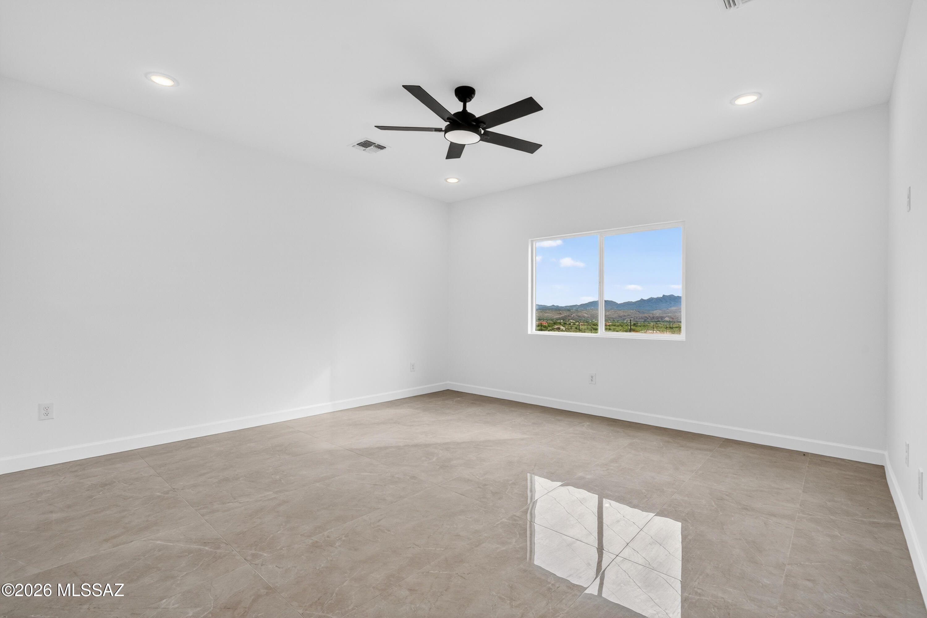 1834 Circulo Glorieta Rio Rico, AZ 85648 - Photo 17 of 35 an empty room with window and ceiling fan