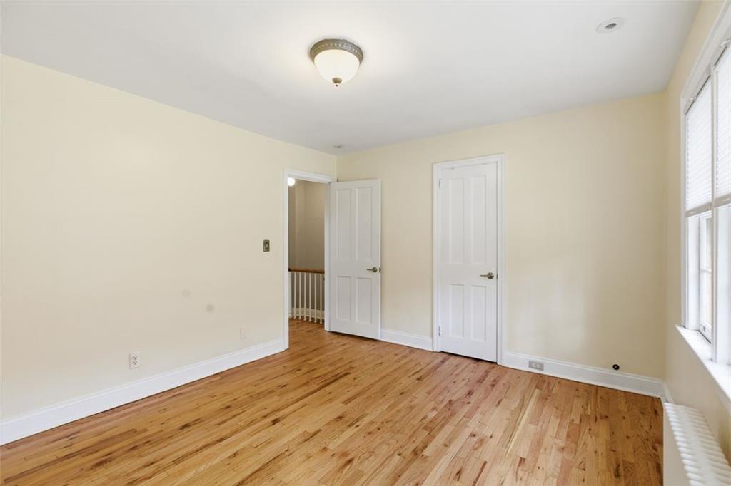 421 Olympia Road Pittsburgh, PA 15211 - Photo 17 of 34 an empty room with wooden floor and windows