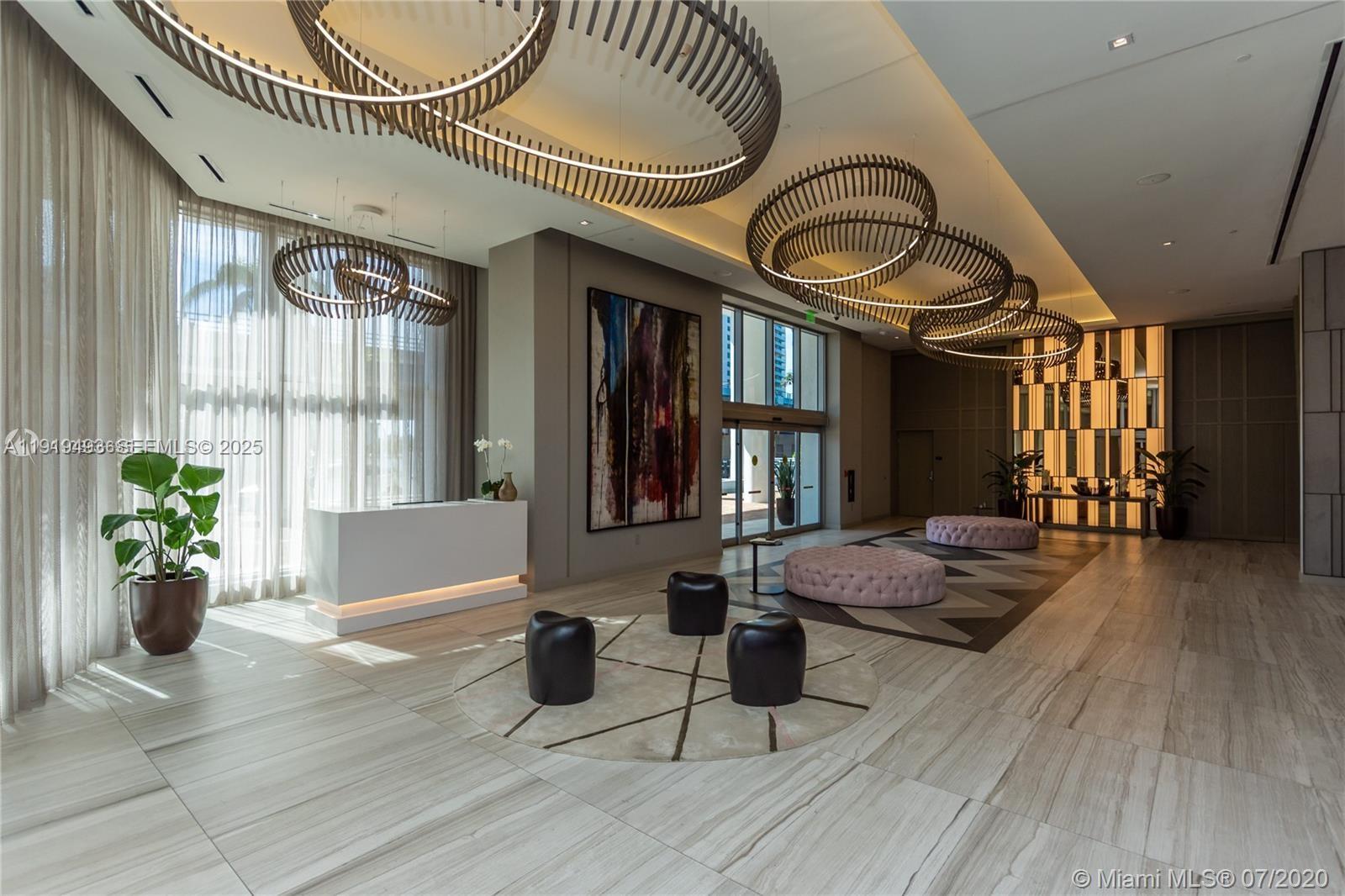 4010 South Ocean Drive, Unit R2904 Hollywood, FL 33019 - Photo 21 of 32 a very nice looking room with a large window and wooden floor