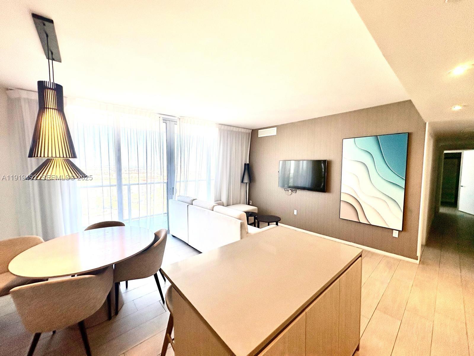 4010 South Ocean Drive, Unit R2904 Hollywood, FL 33019 - Photo 3 of 32 a bedroom with a bed and a table