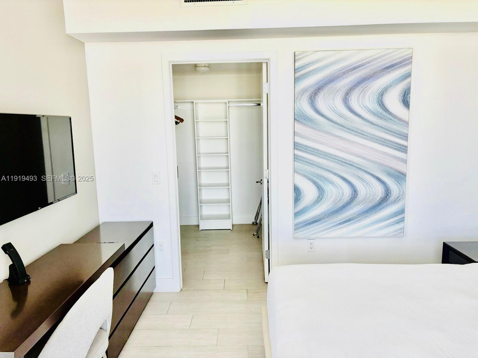 4010 South Ocean Drive, Unit R2904 Hollywood, FL 33019 - Photo 8 of 32 a view of a livingroom with furniture and a flat screen tv