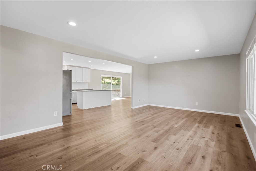 904 Long Bar Road Oroville, CA 95966 - Photo 12 of 50 a view of an empty room with wooden floor and a window