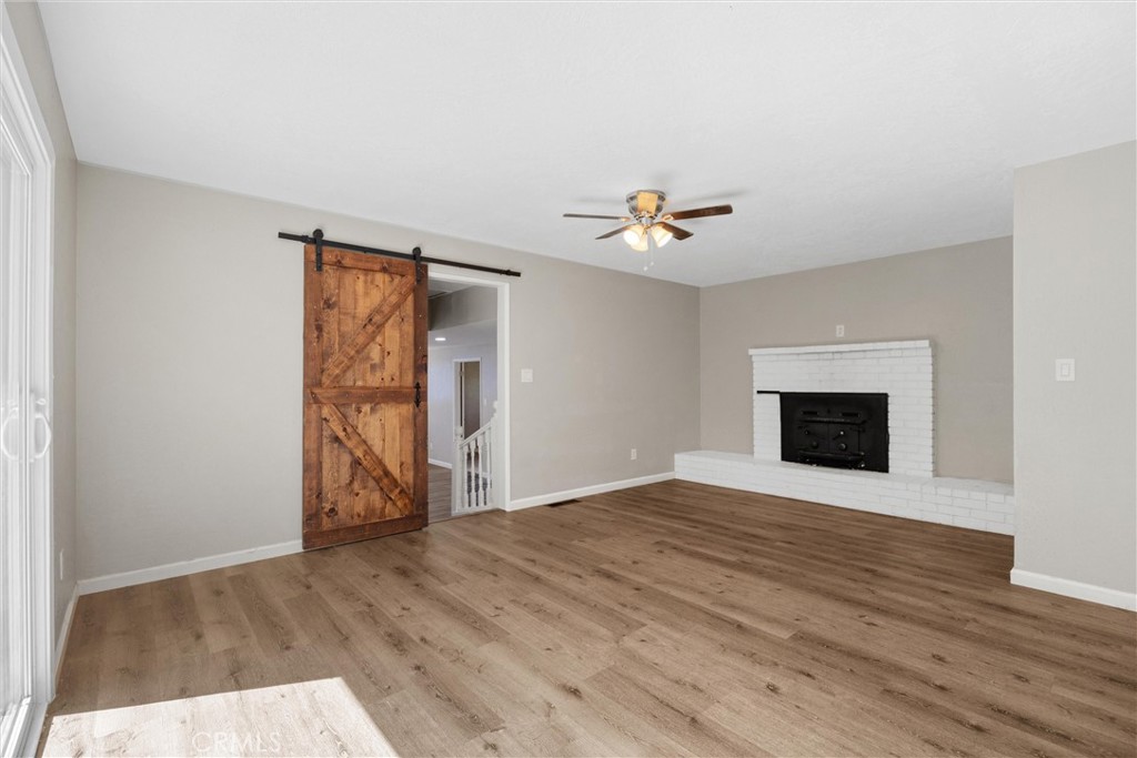 904 Long Bar Road Oroville, CA 95966 - Photo 23 of 50 a view of an empty room with wooden floor and a window
