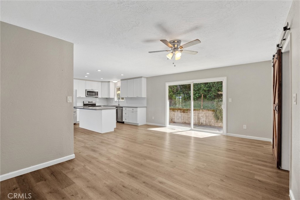 904 Long Bar Road Oroville, CA 95966 - Photo 25 of 50 a view of an empty room with window and wooden floor