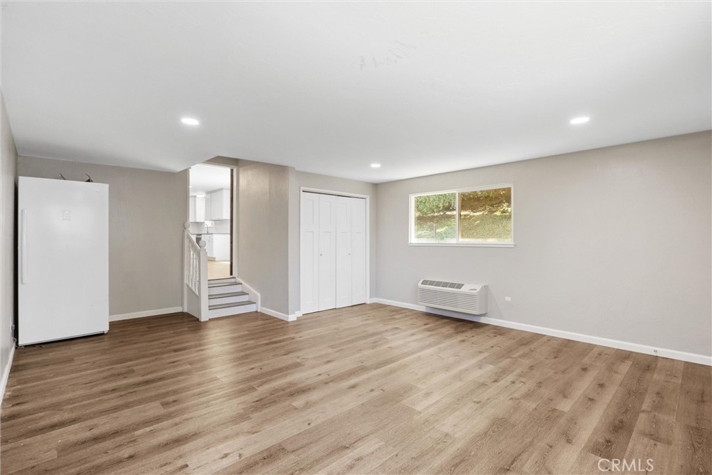 904 Long Bar Road Oroville, CA 95966 - Photo 26 of 50 a view of an empty room with wooden floor and a window