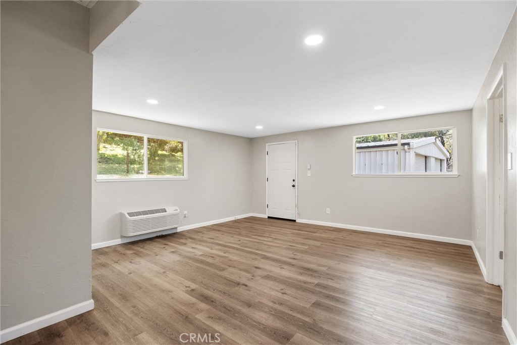 904 Long Bar Road Oroville, CA 95966 - Photo 28 of 50 an empty room with wooden floor and windows