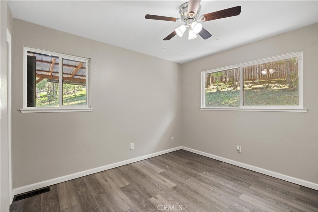 904 Long Bar Road Oroville, CA 95966 - Photo 38 of 50 wooden floor in an empty room with a window
