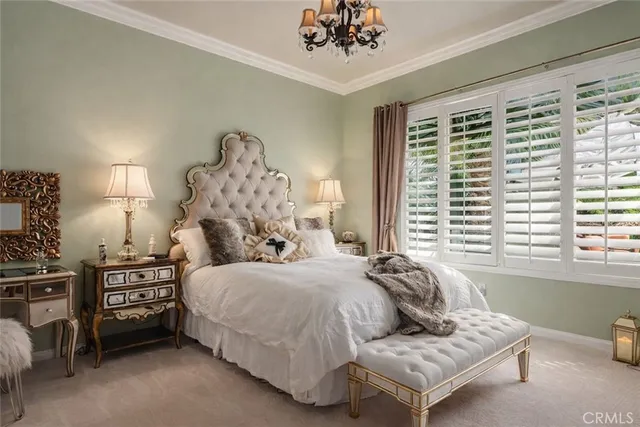 a bedroom with a bed couch and window