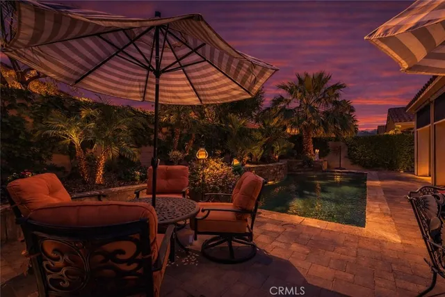 a patio with tables and chairs