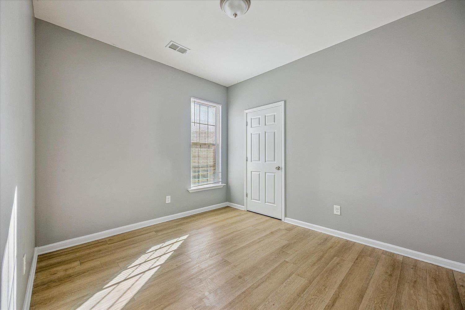 346 Delta Road Memphis, TN 38109 - Photo 11 of 23 a view of empty room with wooden floor and fan