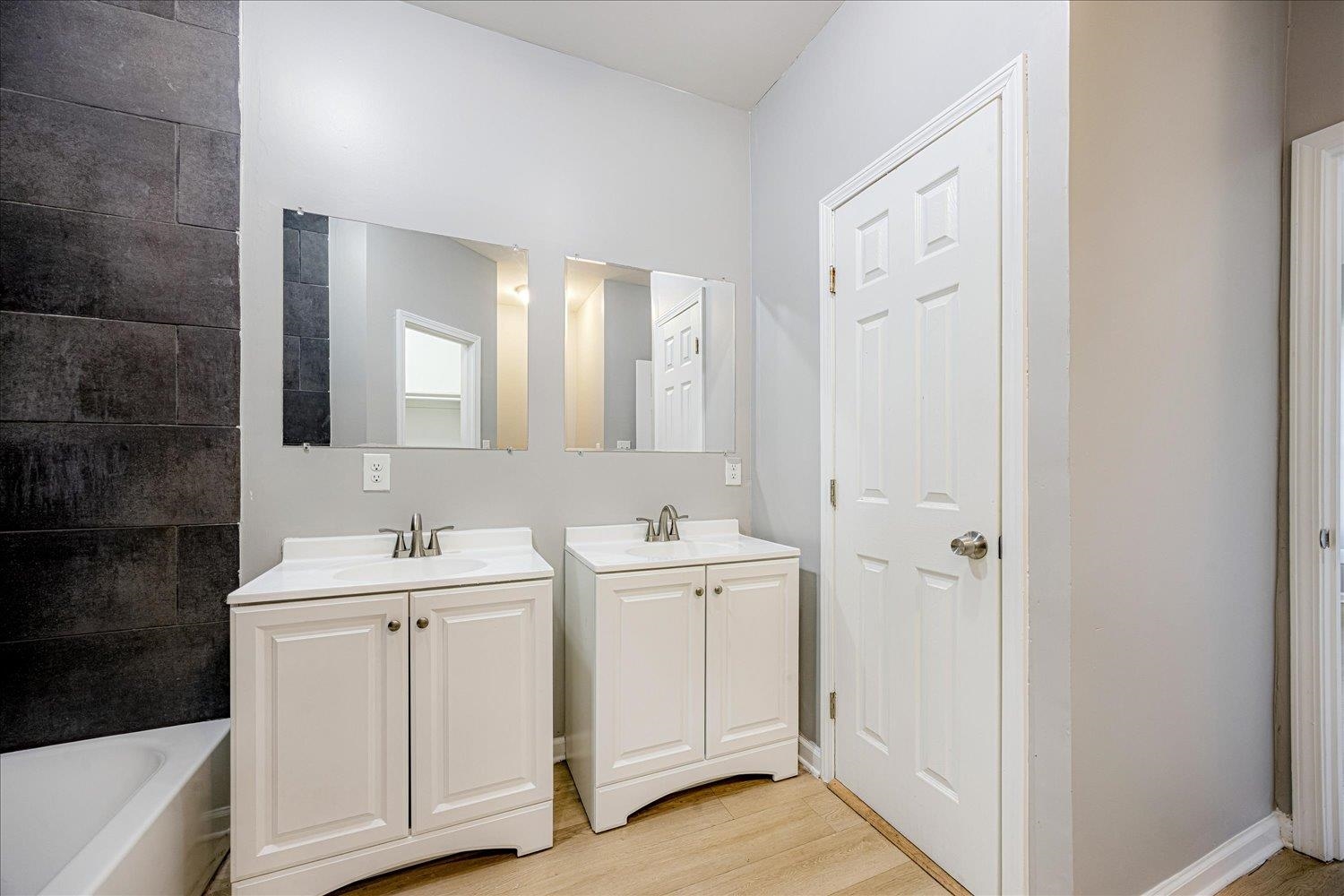 346 Delta Road Memphis, TN 38109 - Photo 17 of 23 a view of a bathroom with 2 sink and mirror