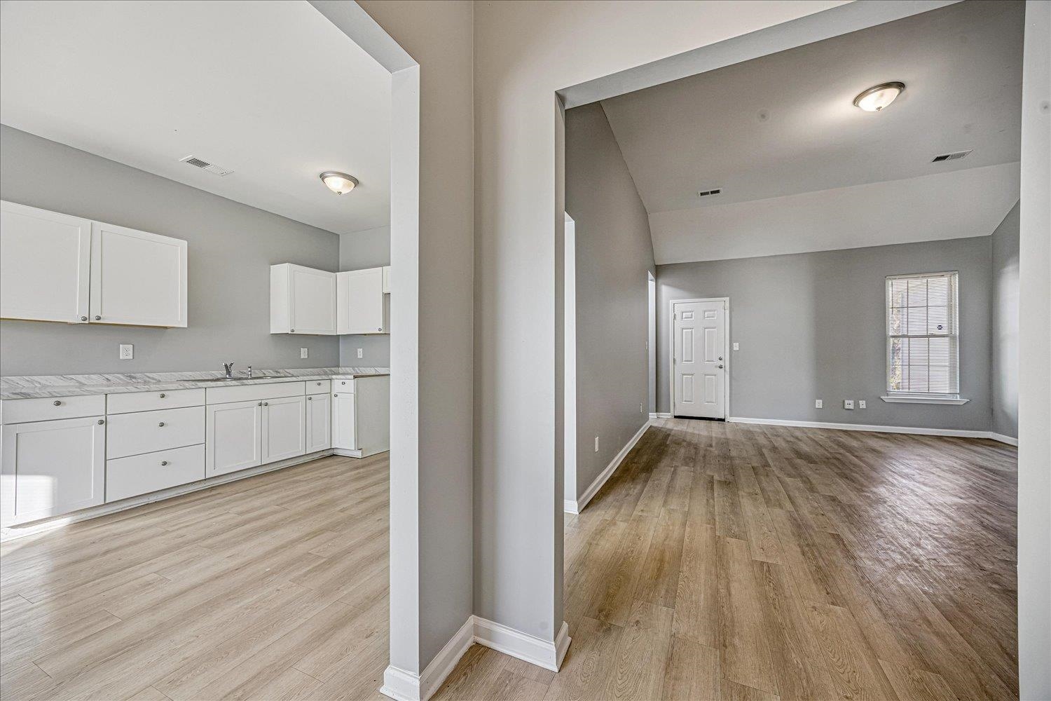 346 Delta Road Memphis, TN 38109 - Photo 4 of 23 a view of a kitchen with wooden floor and electronic appliances