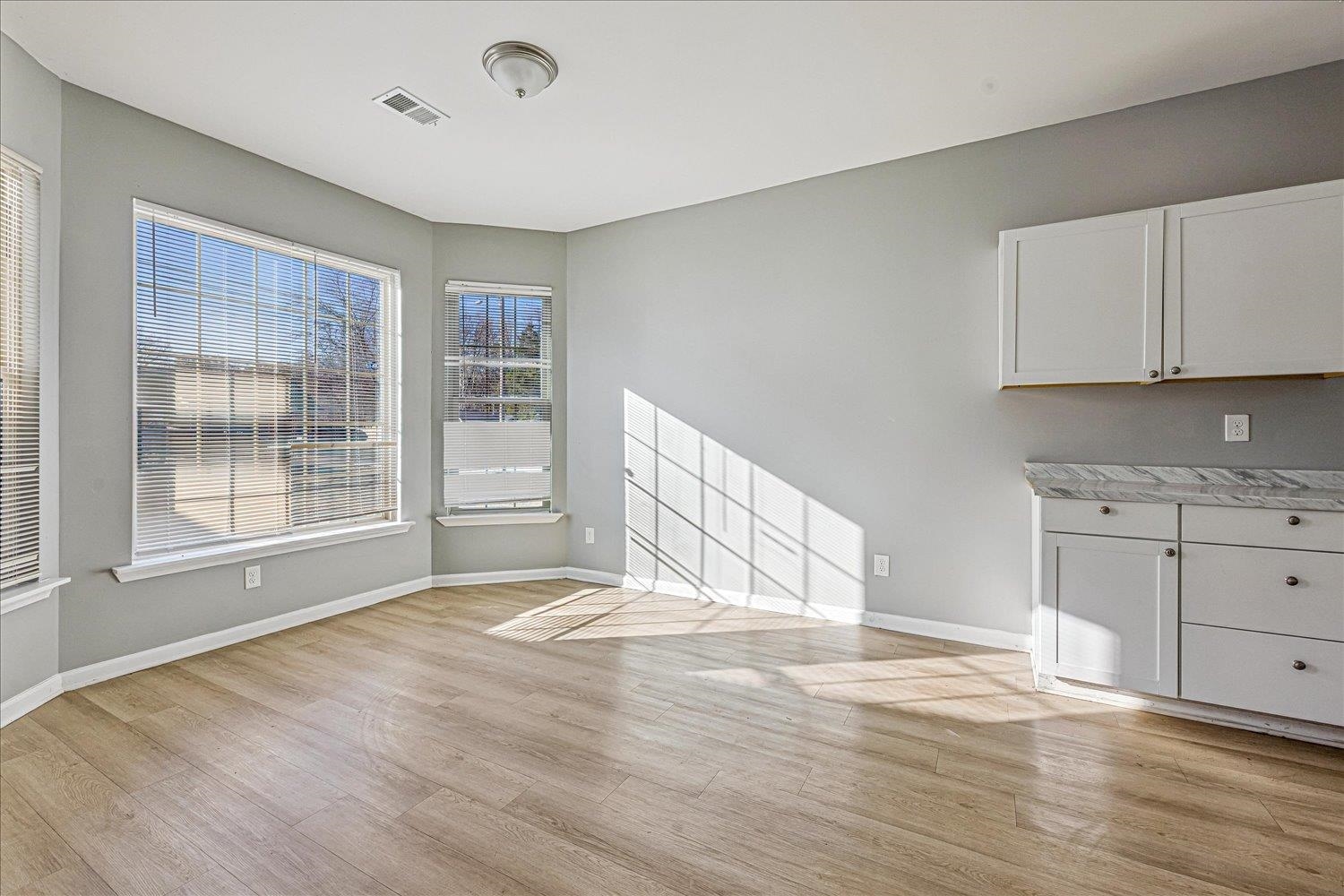 346 Delta Road Memphis, TN 38109 - Photo 6 of 23 a view of an empty room with a window and wooden floor