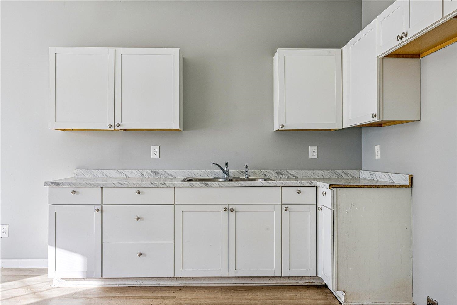 346 Delta Road Memphis, TN 38109 - Photo 8 of 23 a kitchen with granite countertop white cabinets and sink