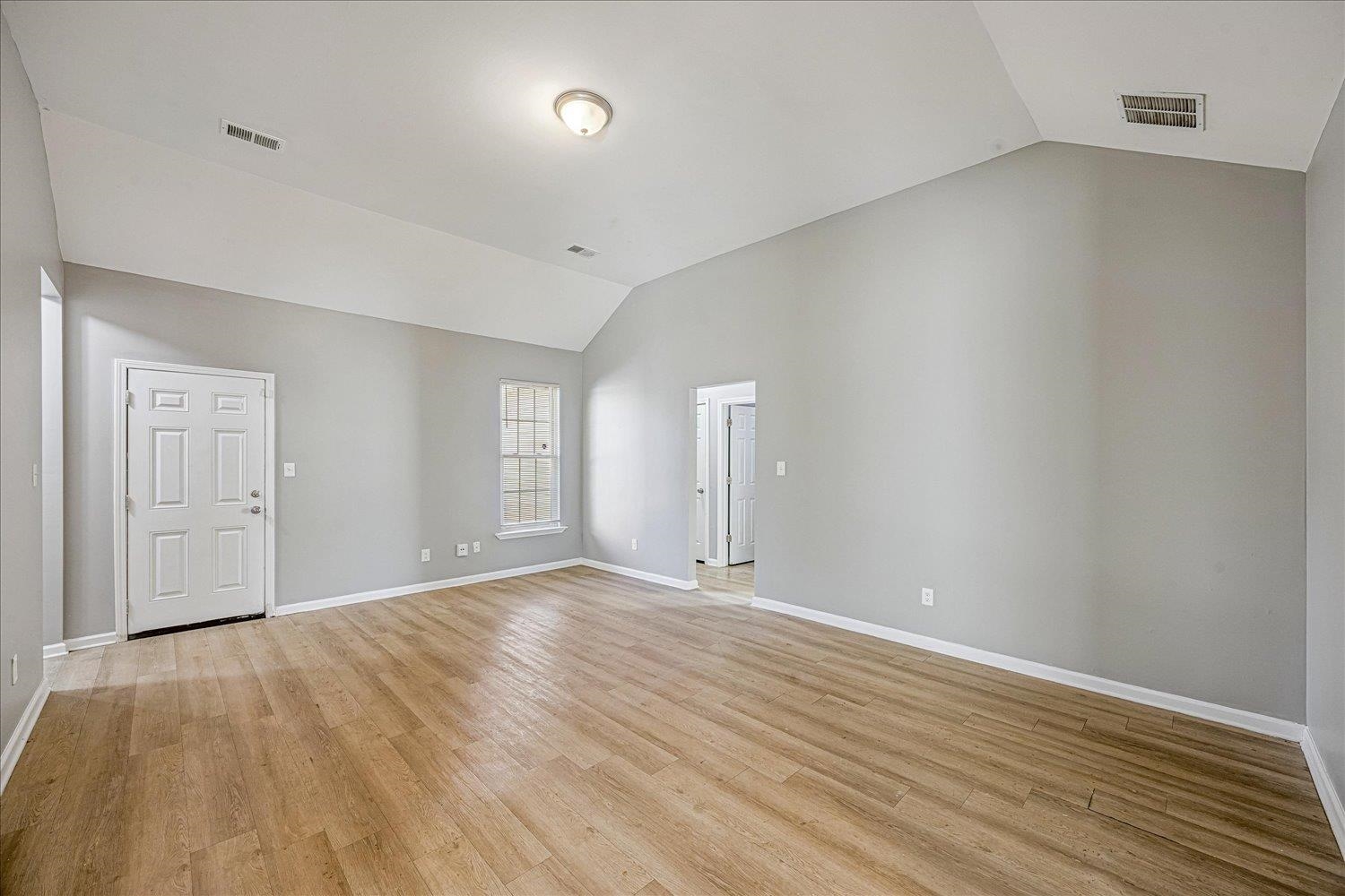 346 Delta Road Memphis, TN 38109 - Photo 9 of 23 a view of an empty room with wooden floor