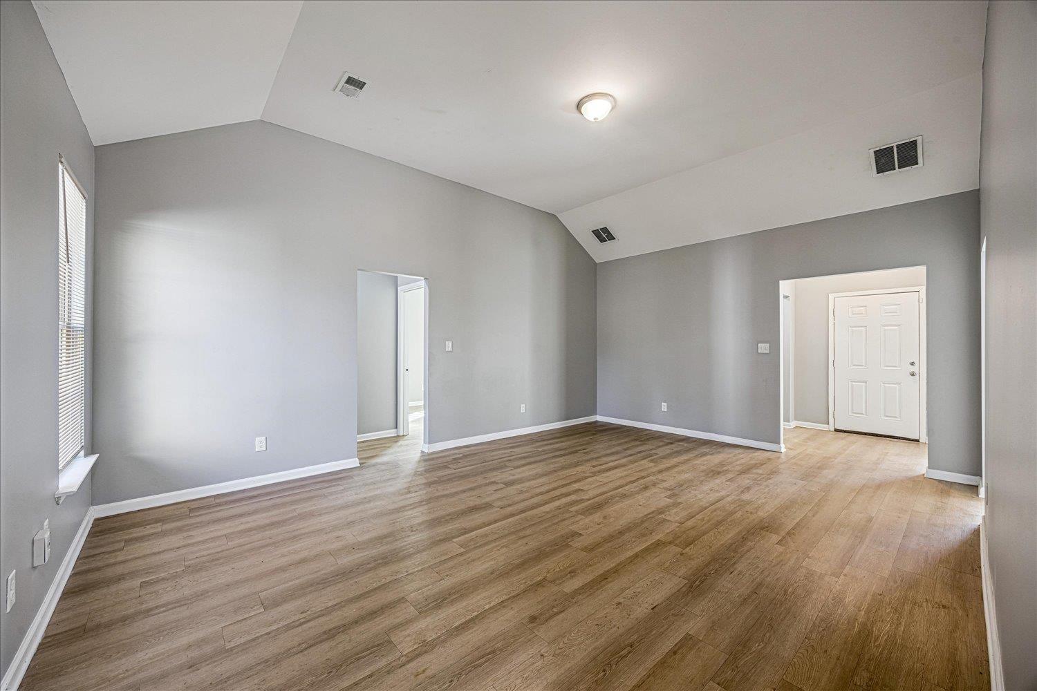 346 Delta Road Memphis, TN 38109 - Photo 10 of 23 a view of an empty room with wooden floor