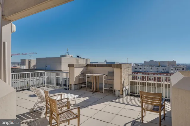 a view of a balcony with chairs
