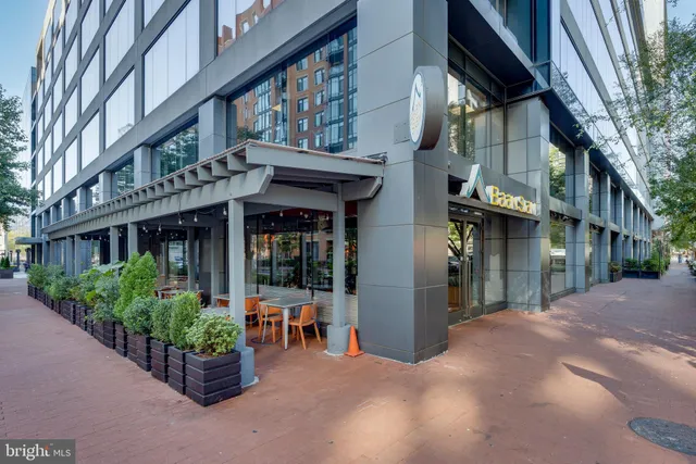 a view of a building with potted plants
