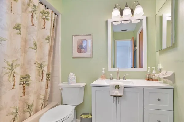 an aerial view of a house with swimming pool and patio