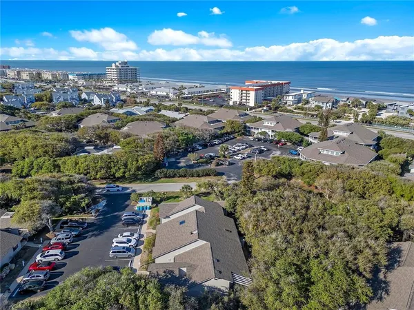 an aerial view of a house with outdoor space and street view