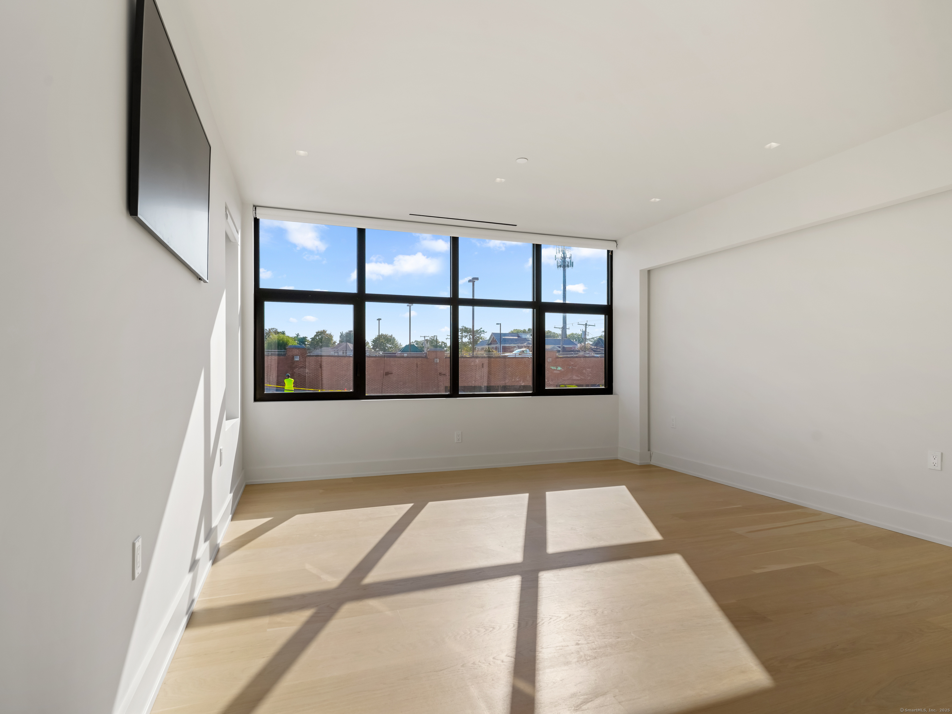 116 Sherman Street, Unit 1 Fairfield, CT 06824 - Photo 11 of 32 a view of an empty room with a window