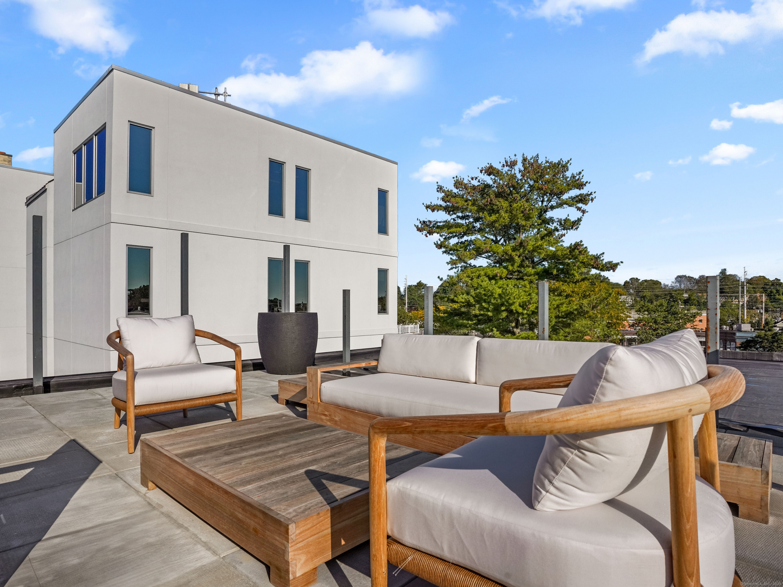 116 Sherman Street, Unit 1 Fairfield, CT 06824 - Photo 14 of 32 a building outdoor space with patio furniture