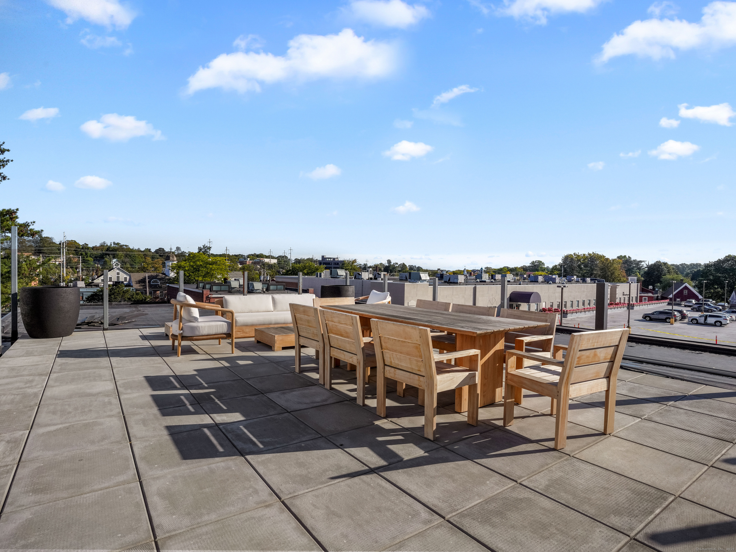 116 Sherman Street, Unit 1 Fairfield, CT 06824 - Photo 15 of 32 a terrace with outdoor seating and city view