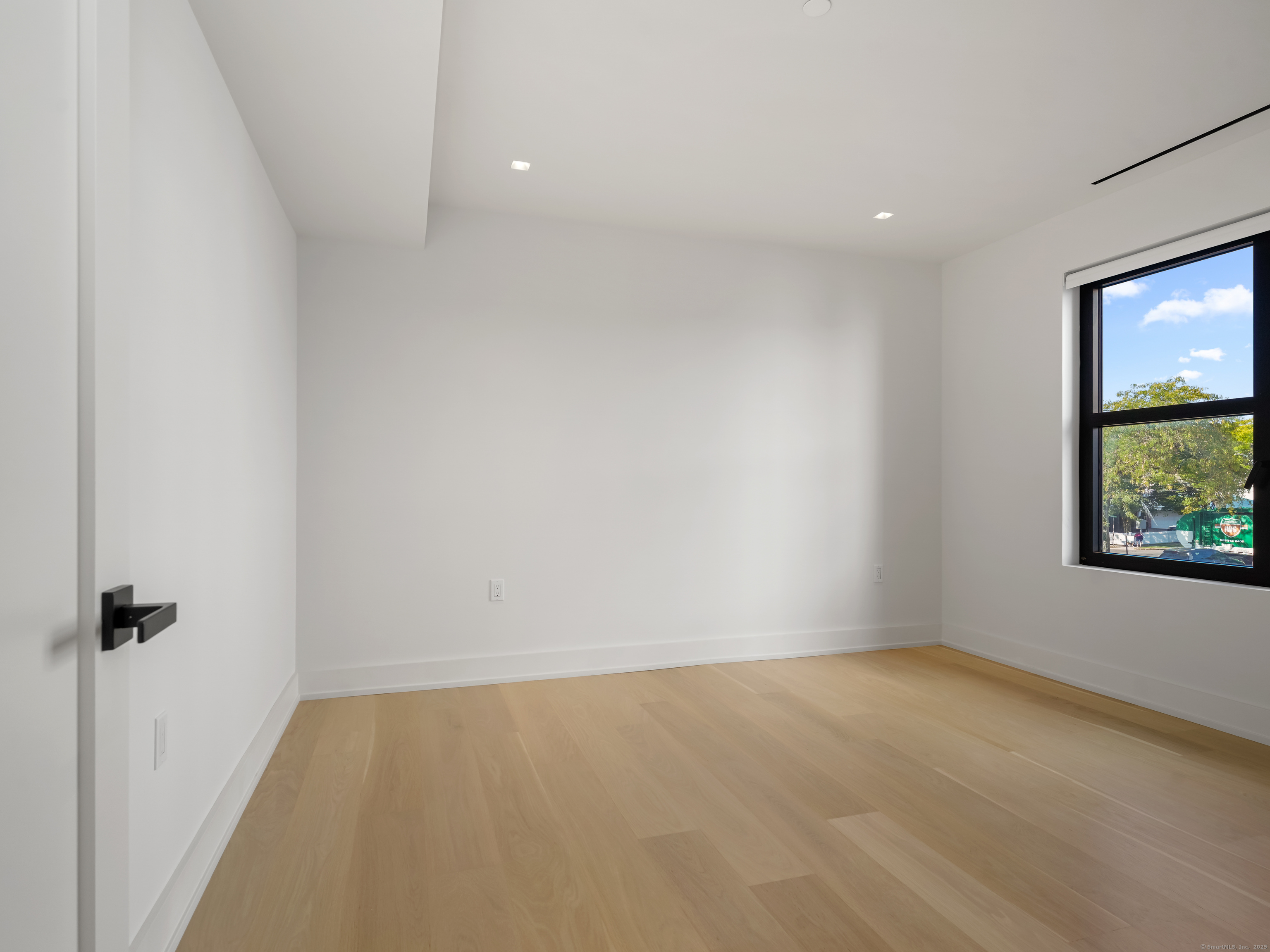 116 Sherman Street, Unit 1 Fairfield, CT 06824 - Photo 22 of 32 a view of an empty room