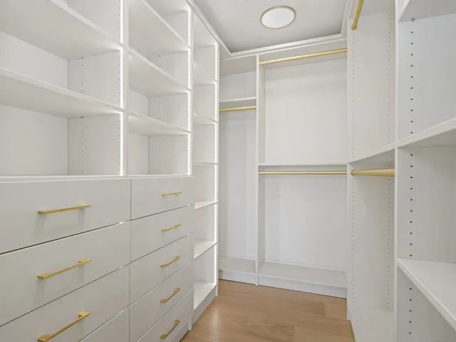 a view of an empty walk in closet