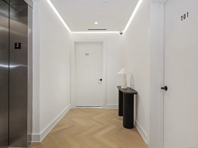a view of a livingroom with wooden floor