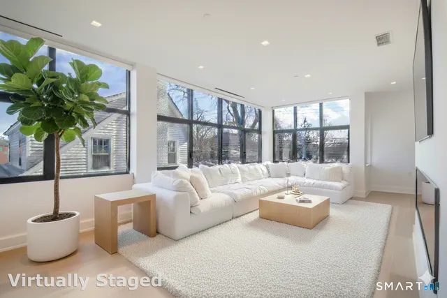 a view of a hallway with wooden shelves