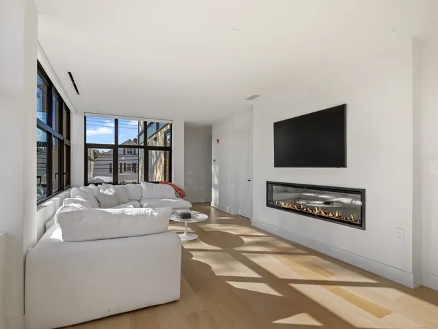 a view of a livingroom with wooden floor