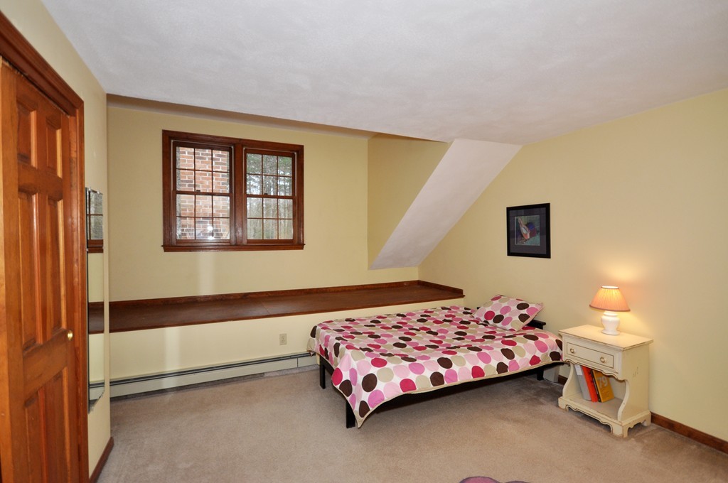 29 Blanchard Road Boxborough, MA 01719 - Photo 20 of 30 a bedroom with a bed and a lamp on the dresser