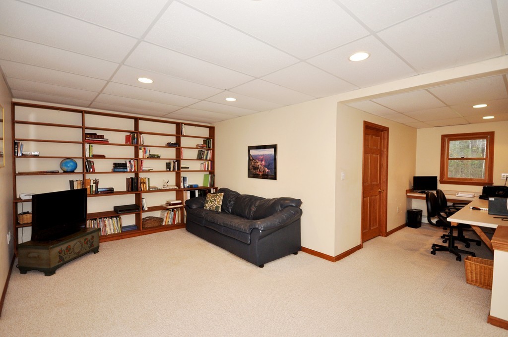 29 Blanchard Road Boxborough, MA 01719 - Photo 24 of 30 a living room with furniture and a flat screen tv