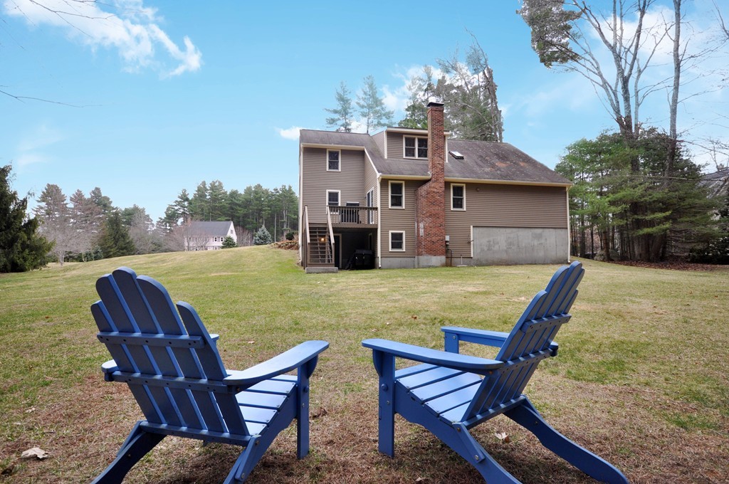 29 Blanchard Road Boxborough, MA 01719 - Photo 25 of 30 a view of a house with backyard porch and furniture