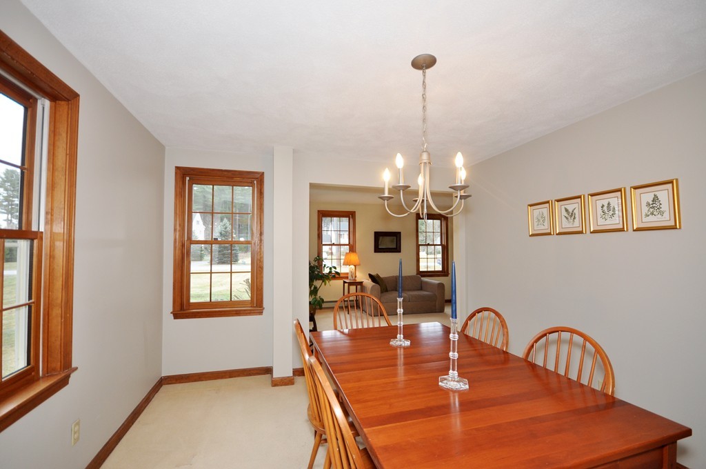 29 Blanchard Road Boxborough, MA 01719 - Photo 6 of 30 a dining room with furniture a chandelier and window