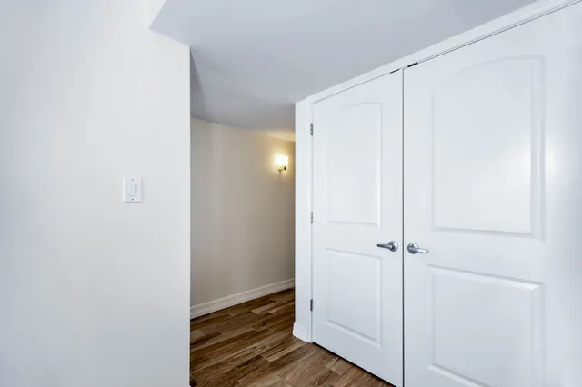 a bathroom with a granite countertop sink toilet and vanity