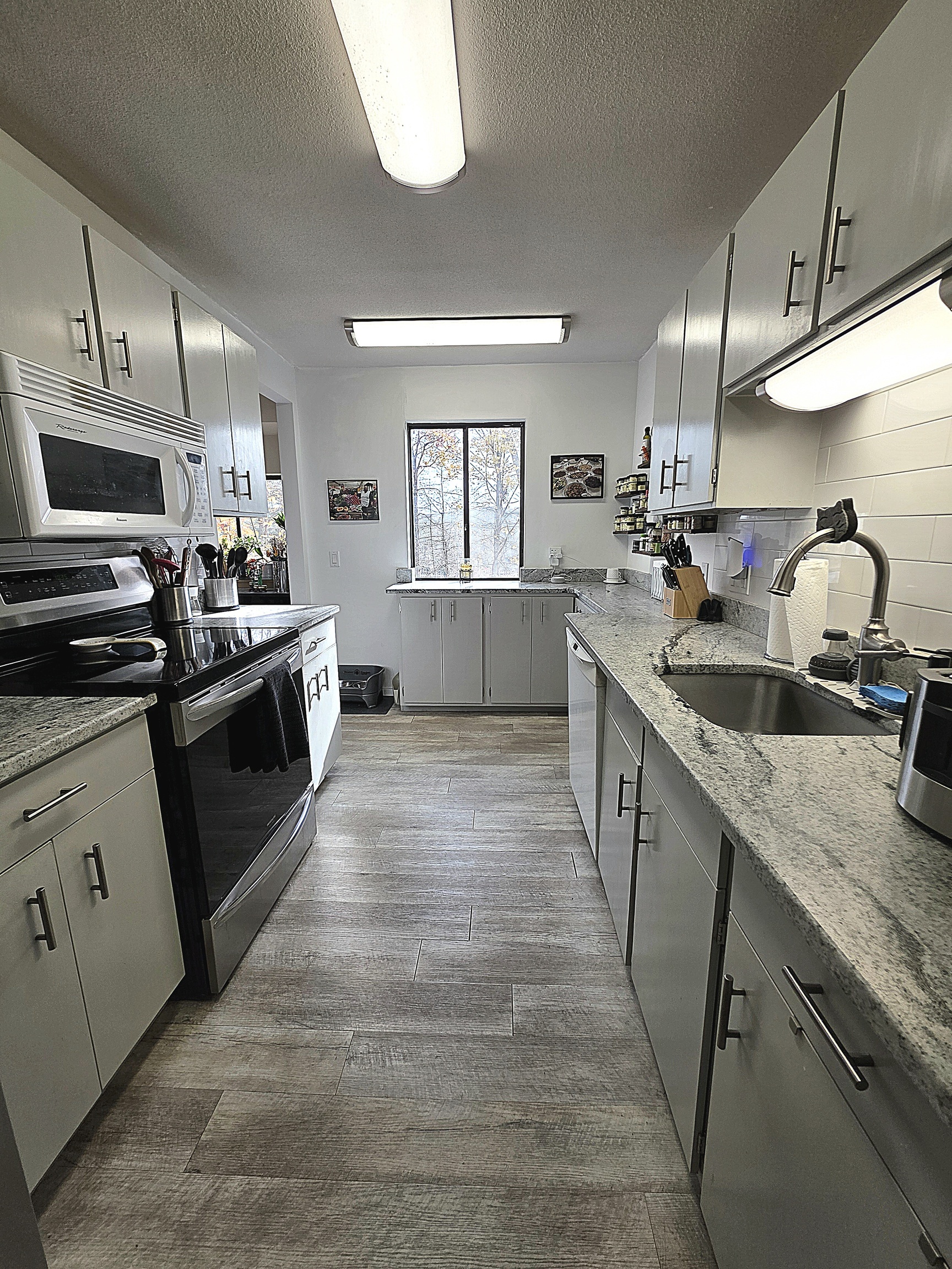 39 Heritage Village, Unit C Southbury, CT 06488 - Photo 19 of 39 View of the galley kitchen from the front door.