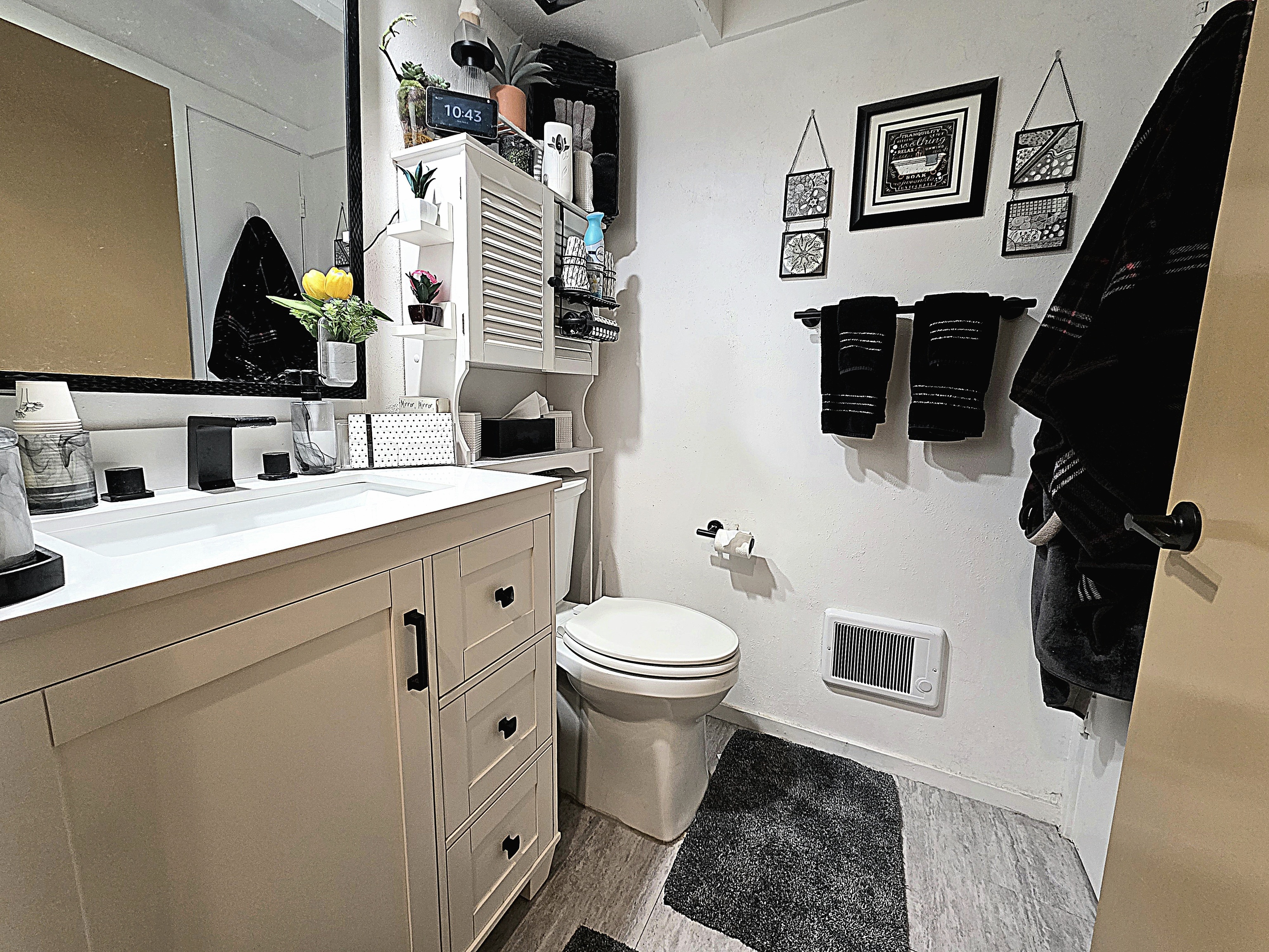 39 Heritage Village, Unit C Southbury, CT 06488 - Photo 32 of 39 Hall bath has a new vanity, toilet, and heater plus a handy linen closet and reglazed shower.