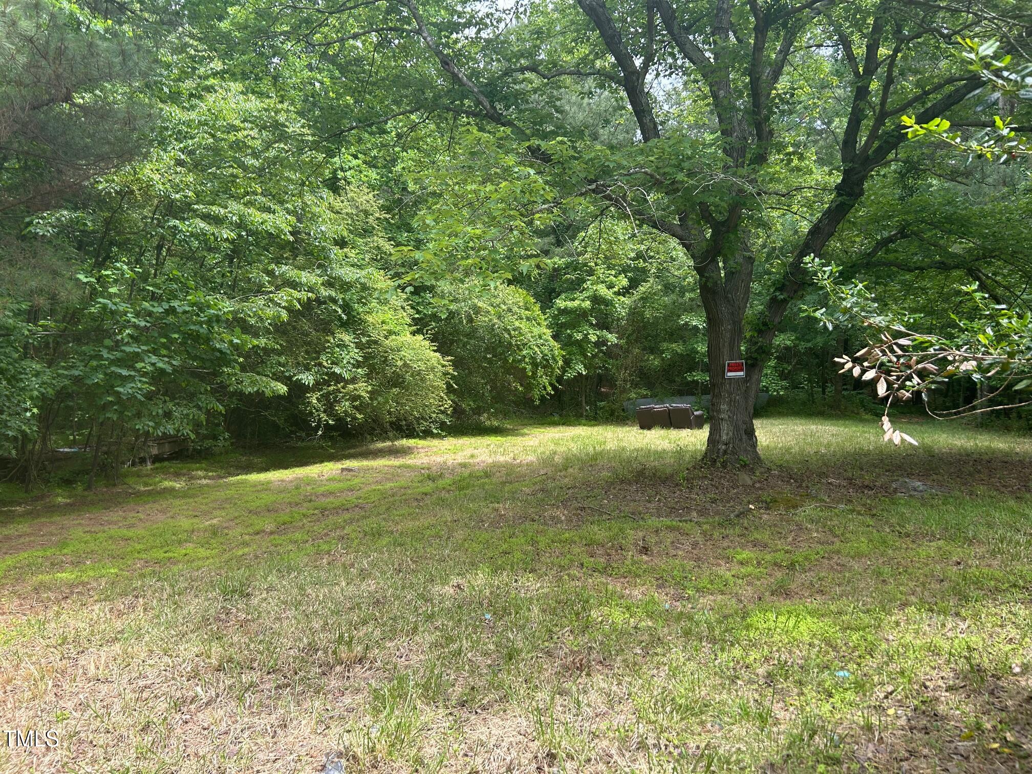 5828 Old Smithfield Road Apex, NC 27539 - Photo 2 of 4 a view of a yard with a trees
